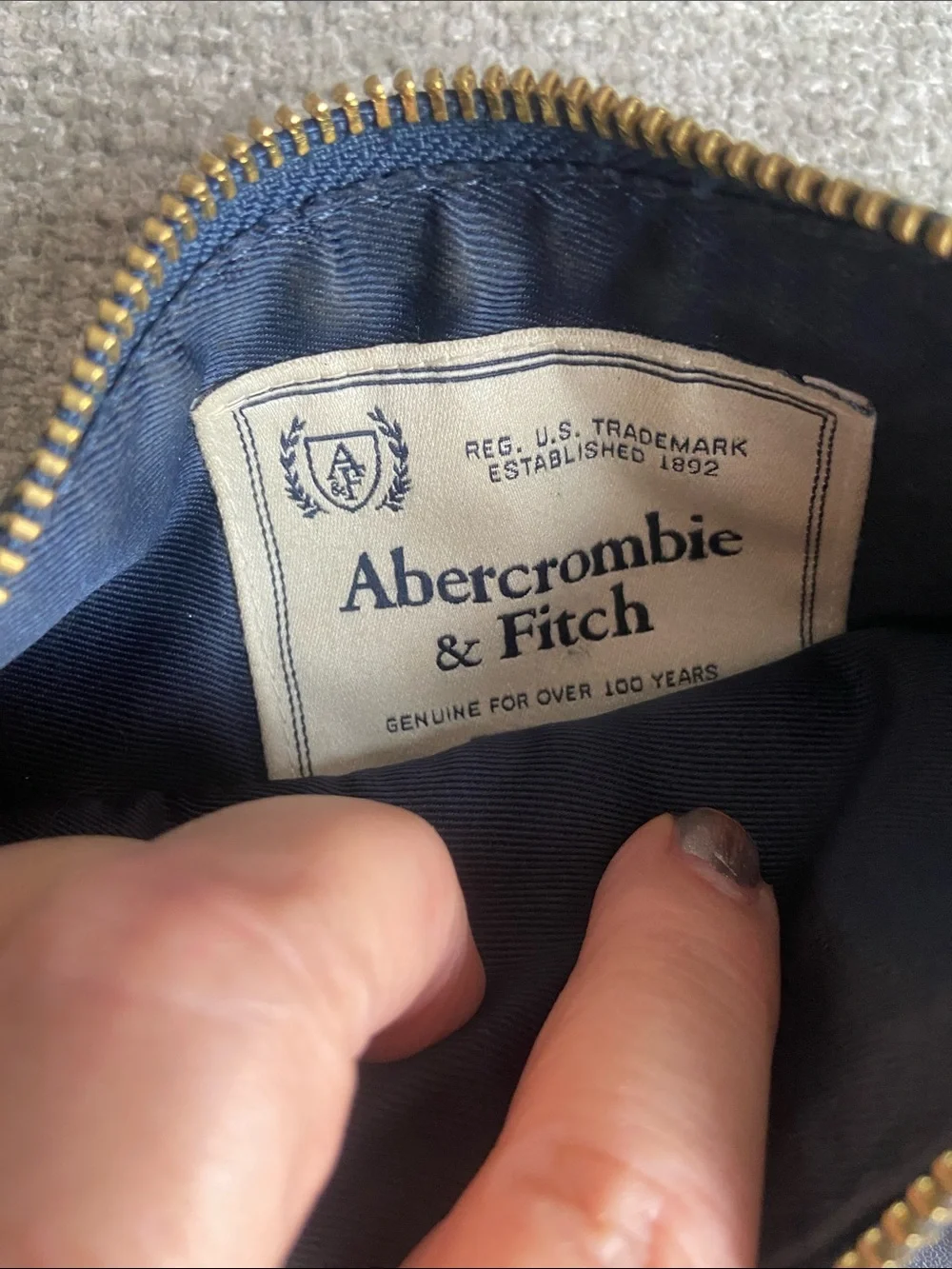 Abercrombie & Fitch Navy Pom-Pom Wristlet Clutch